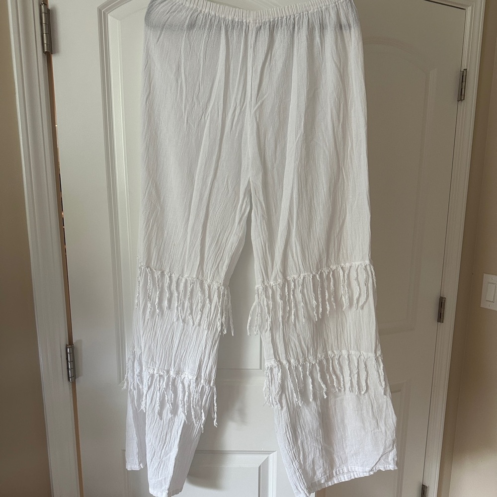 Fun white gauzy pants with fringe. New with out tags